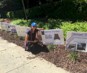 (Pictured - scholarship winner Sabrina Dunbar.  Neighbors posted signs congratulating this year’s graduates)