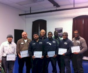 Pictured from L-R:  Chris Cheah, Brian Clarke, Wilver Villagran, Dan Fittro, Raymundo Perez, Bobby Alford, Miguel Torres and Lawrence Wilder