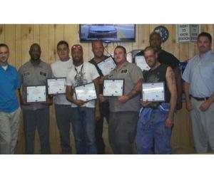 (Sur la photo de gauche à droite : Olivier Marietta, Dwayne Allen, Victor Luna, Shannon Butler, Chris Homesley, Mark Kane, Daniel Eady, Steve Kelly et Mike Brown)