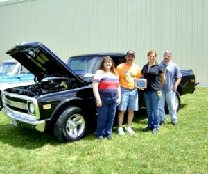 (Pictured from L-R: Karen Shinnebarger, Mark Clair (truck owner), Alicia Hardacre and Brian Lowe)